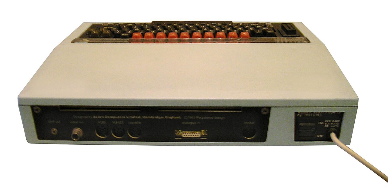 The back panel of a BBC Micro showing its row of connectors, including RGB, RS-423, cassette, analogue and Econet sockets