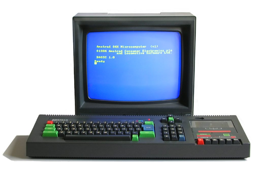 The Amstrad CPC 464: a black keyboard unit with red, green and blue keys and a cassette deck built in on the right