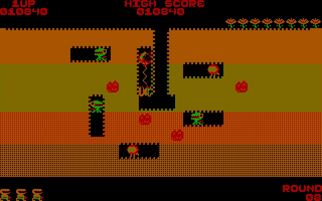 Dig Dug on the PC in CGA colours: tunnels dug through orange earth, with enemies and rocks