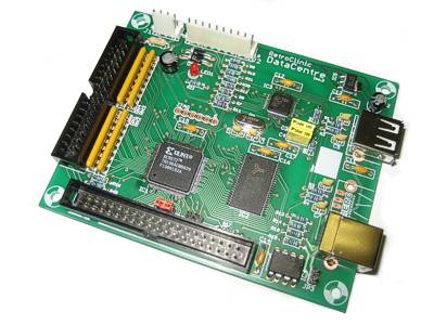 The RetroClinic DataCentre circuit board (issue 2), with a USB socket, a USB-B socket, IDE and 1 MHz bus connectors, and a Xilinx chip